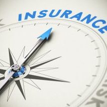 Compass needle pointing the word insurance. Concept image blue and beige tones